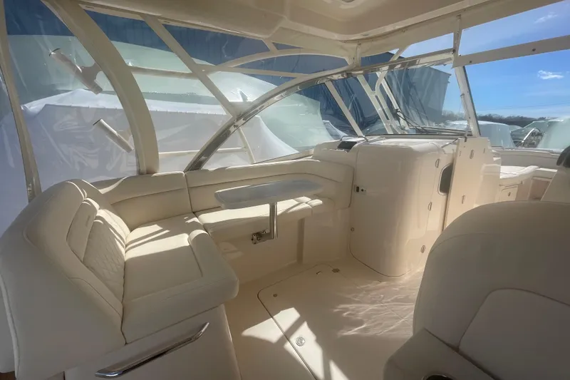 Slide: The Image of Interior of 2023 Grady-White Freedom 335 boat, featuring luxurious seating and helm area. - 29