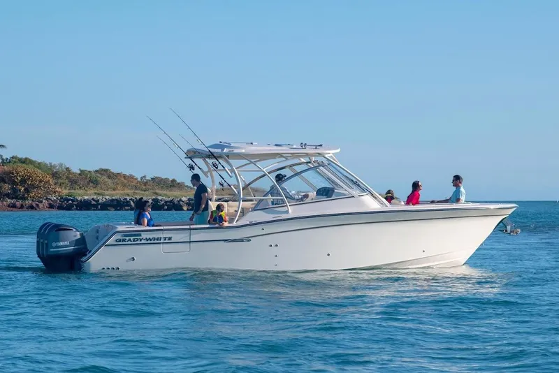 Slide: The Image of Manufacturer Provided Image: 2023 Grady-White Freedom 335 boat cruising on the water with passengers. - 3