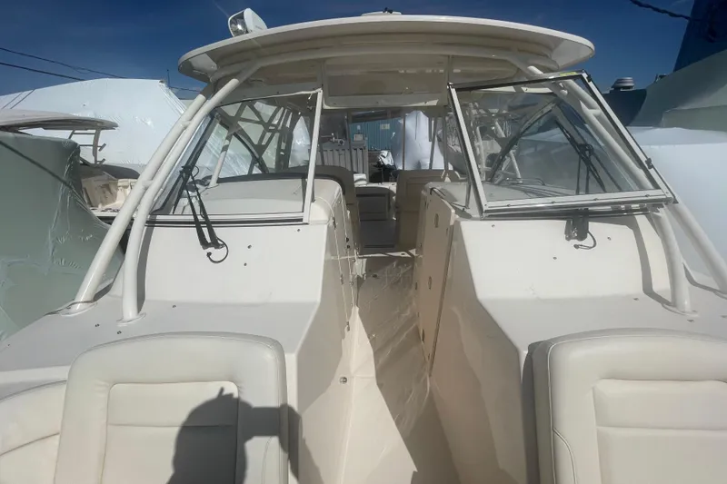 Slide: The Image of 2023 Grady-White Freedom 335 boat with open cockpit and seating area. - 32