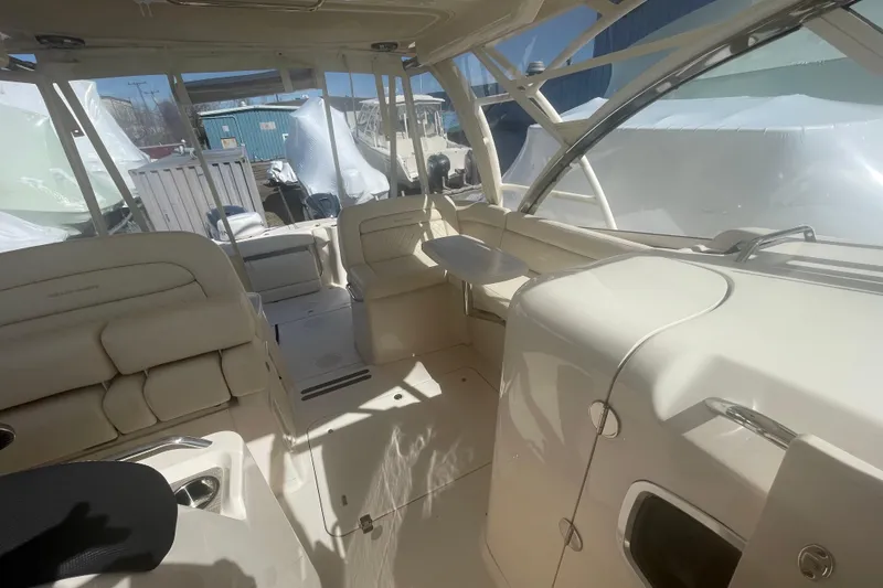 Slide: The Image of 2023 Grady-White Freedom 335 boat interior with seating and helm area. - 33