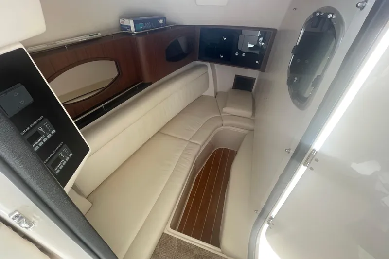 Slide: The Image of Interior cabin of 2023 Grady-White Freedom 335 boat with leather seating and wood accents. - 34