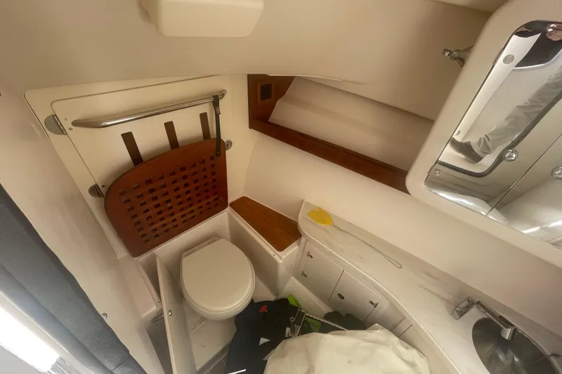 Slide: The Image of 2023 Grady-White Freedom 335 boat bathroom interior with toilet and sink. - 35