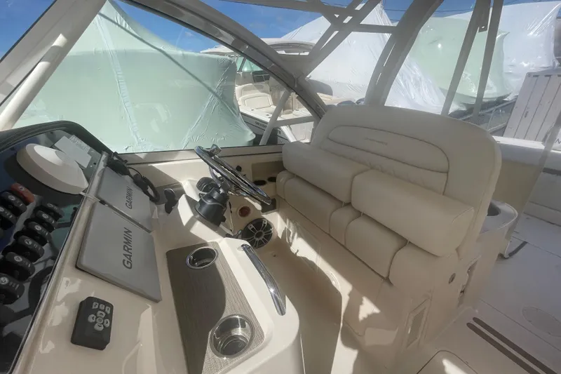 Slide: The Image of 2023 Grady-White Freedom 335 boat interior with Garmin navigation system. - 36