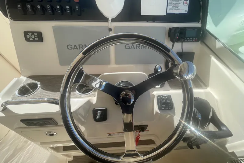 Slide: The Image of Steering wheel and controls of 2023 Grady-White Freedom 335 boat. - 37