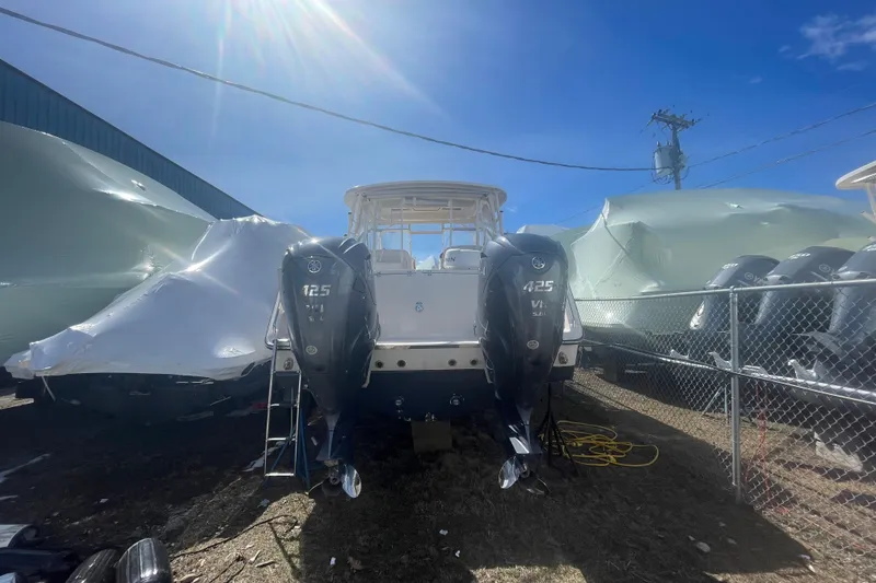 Slide: The Image of 2023 Grady-White Freedom 335 boat with twin 425 V8 engines in storage yard. - 40