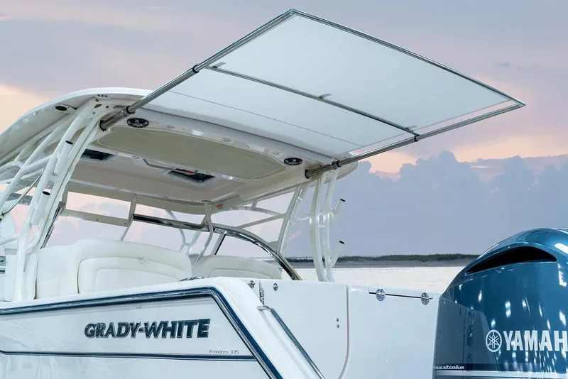 Slide: The Image of Manufacturer Provided Image: 2023 Grady-White Freedom 335 boat with Yamaha engine at sunset. - 6