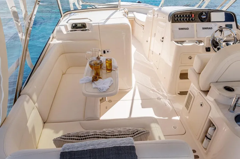 Slide: The Image of Manufacturer Provided Image: 2023 Grady-White Freedom 335 boat interior with seating and refreshments. - 8