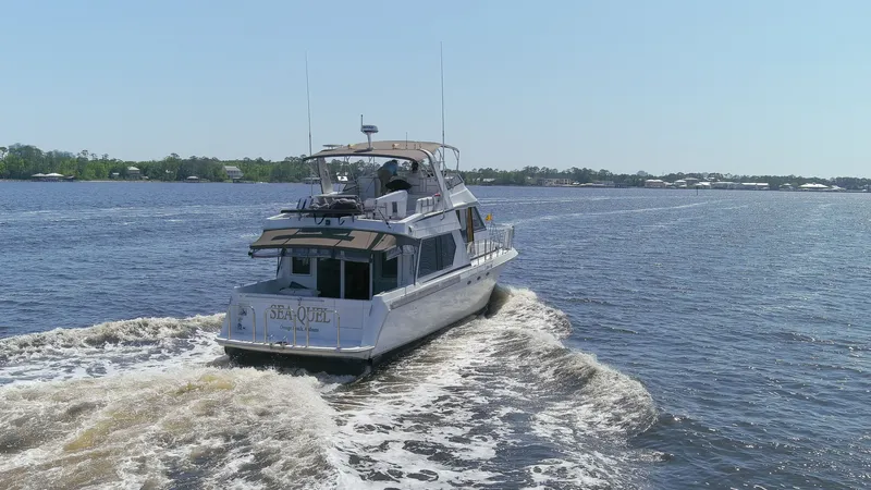 Slide: The Image of Navigator 5600 Sundance Pilothouse 1997 on calm waters. - 13