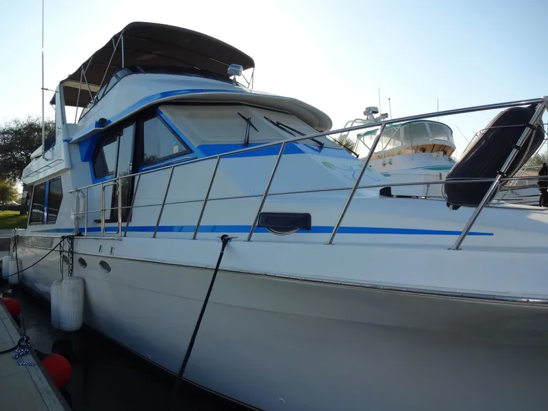 Slide: The Image of 1997 Navigator 5600 Sundance Pilothouse docked at marina. - 21