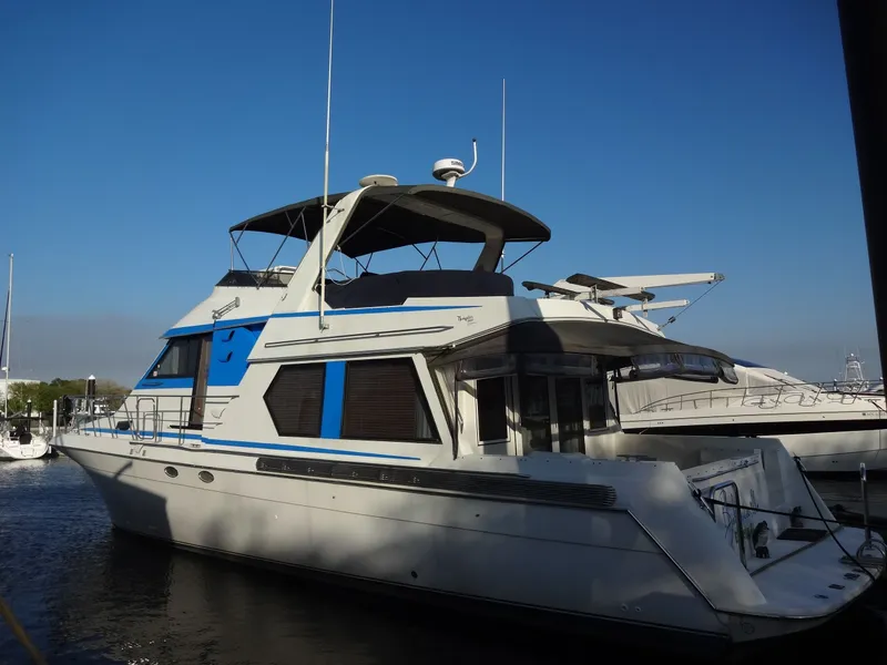 Slide: The Image of 1997 Navigator 5600 Sundance Pilothouse yacht docked at marina. - 25