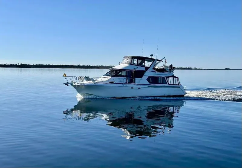 Slide: The Image of Navigator 5600 Sundance Pilothouse 1997 on calm water. - 3