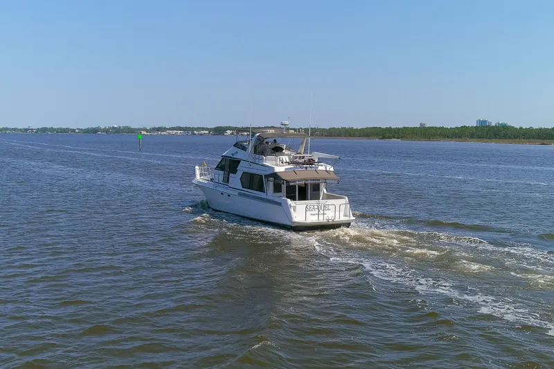 Slide: The Image of Navigator 5600 Sundance Pilothouse 1997 on calm waters. - 33