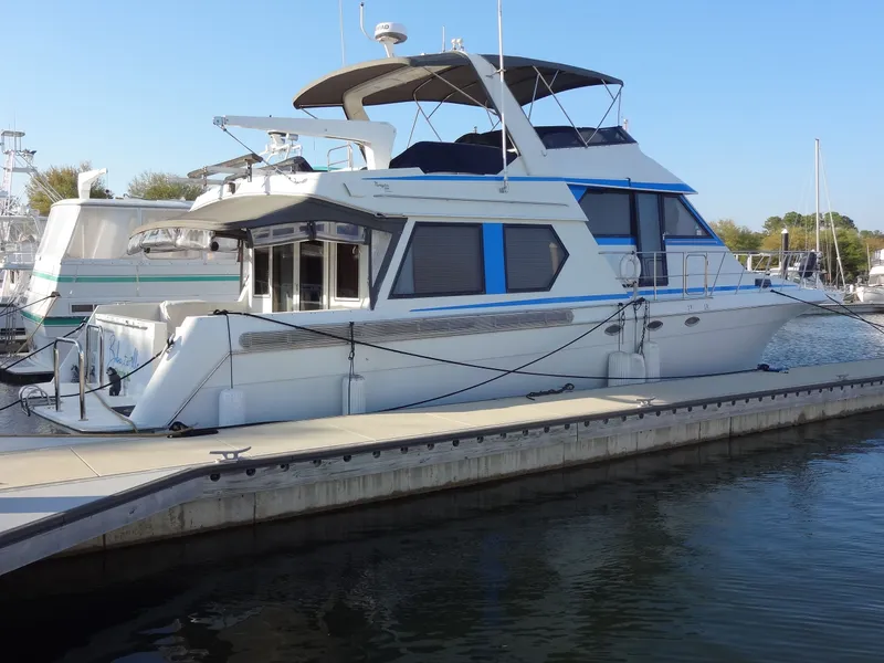 Slide: The Image of 1997 Navigator 5600 Sundance Pilothouse docked at marina. - 4
