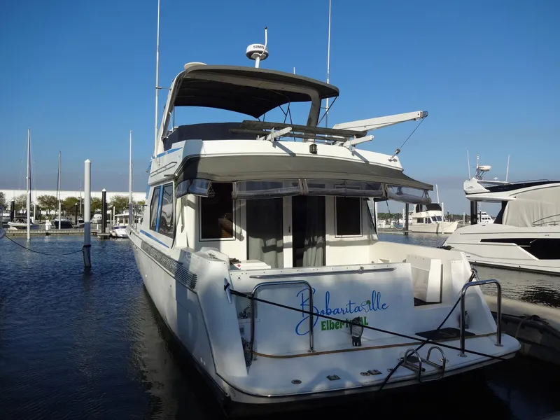 Slide: The Image of 1997 Navigator 5600 Sundance Pilothouse docked on a sunny day. - 7