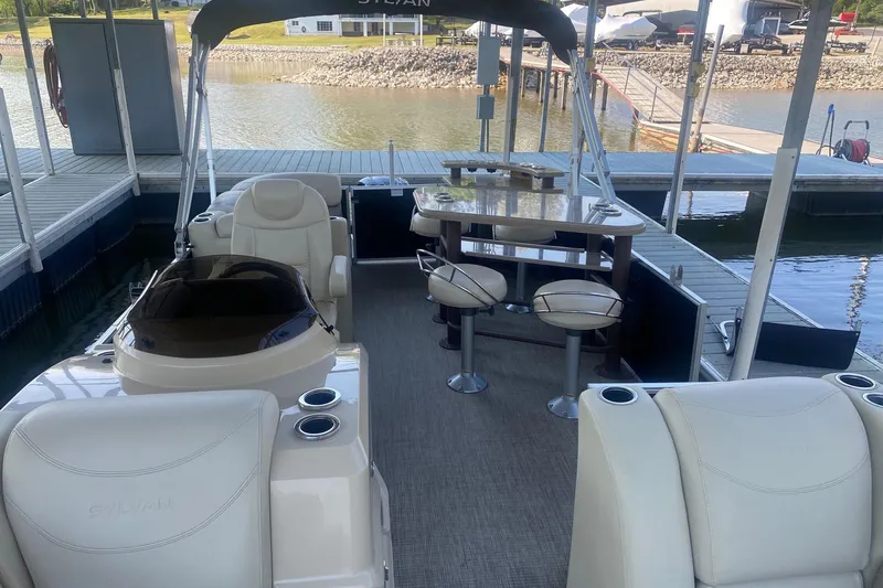 Slide: The Image of 2017 Sylvan Mirage Cruise 8524 LZ PB pontoon boat interior at dock. - 7