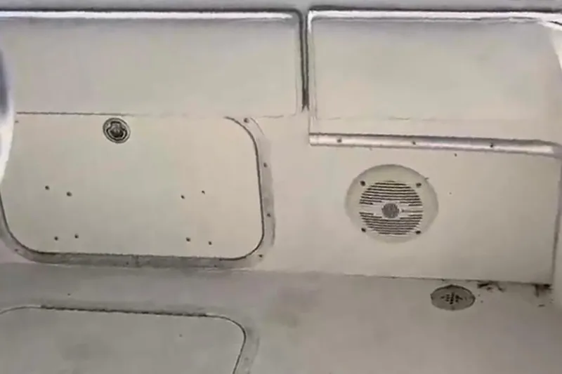 Slide: The Image of 2001 Fountain 31 Tournament Edition boat interior with speaker and storage compartment. - 5