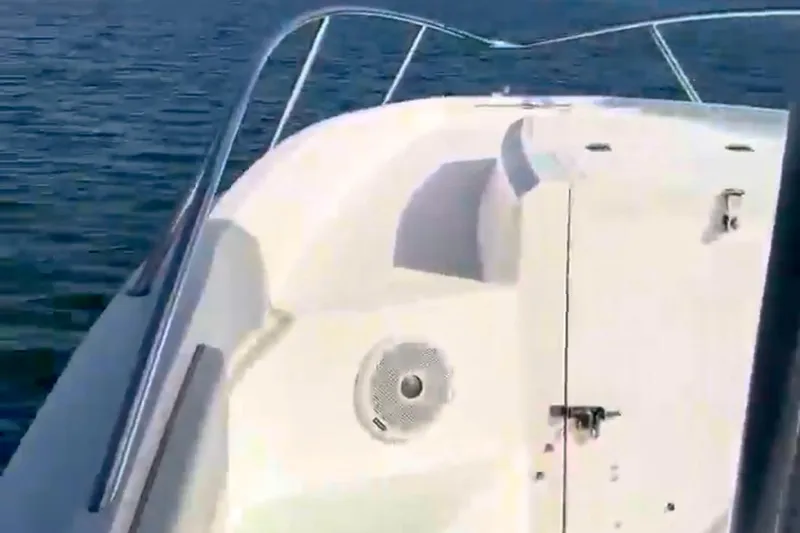 Slide: The Image of 2001 Fountain 31 Tournament Edition boat on water, featuring sleek white deck design. - 6