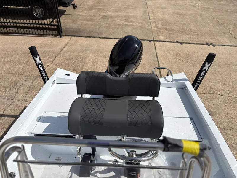 Slide: The Image of 2026 Xpress H20B Hyper-Lift Bay boat with black seat and motor. - 4