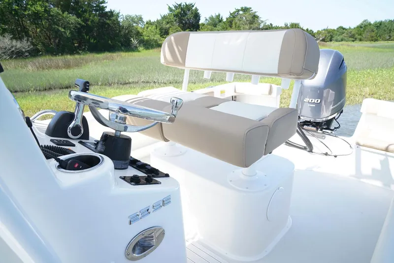 Slide: The Image of Manufacturer Provided Image: Parker 23 Special Edition 2019 boat interior with steering wheel and seating. - 13