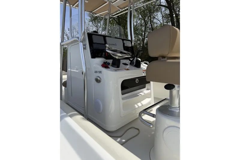 Slide: The Image of 2019 Parker 23 Special Edition boat console with Garmin navigation system and beige seating. - 2