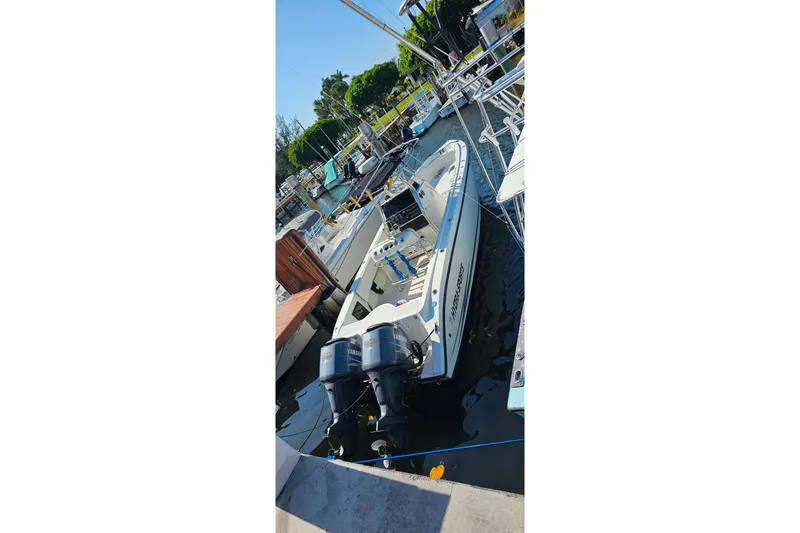 Slide: The Image of A 1999 Hydra-Sports 3000 CC boat docked with dual Yamaha outboard motors. - 4