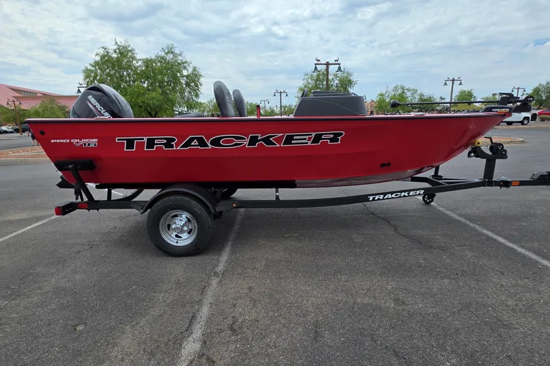 The Image of 2026 Tracker Pro Guide V-16 SC boat in vibrant red on a trailer. - 0