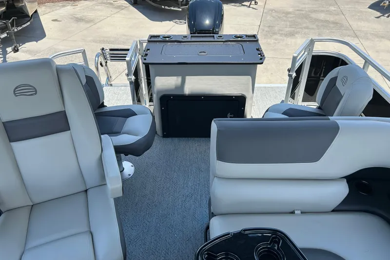 Slide: The Image of 2026 Sun Tracker Fishin' Barge 20 DLX interior with comfortable seating and fishing station. - 5