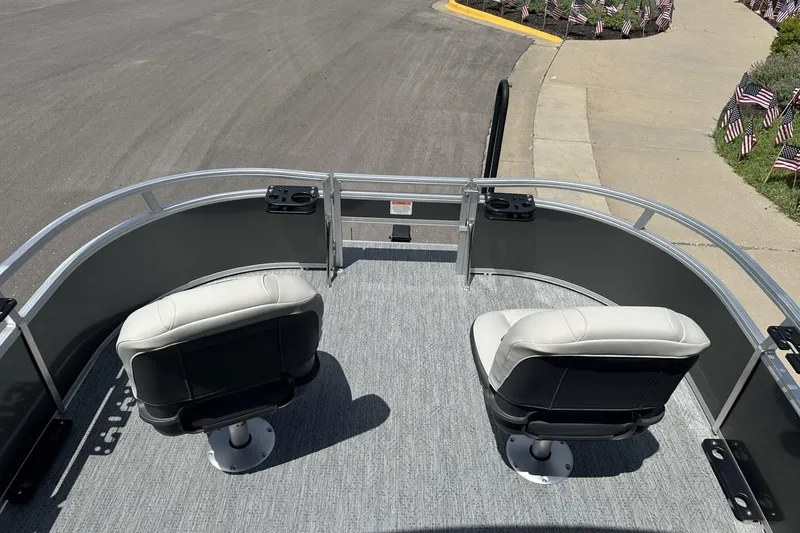 Slide: The Image of 2026 Sun Tracker Bass Buggy 16 XL Select pontoon boat with dual swivel seats on deck. - 8