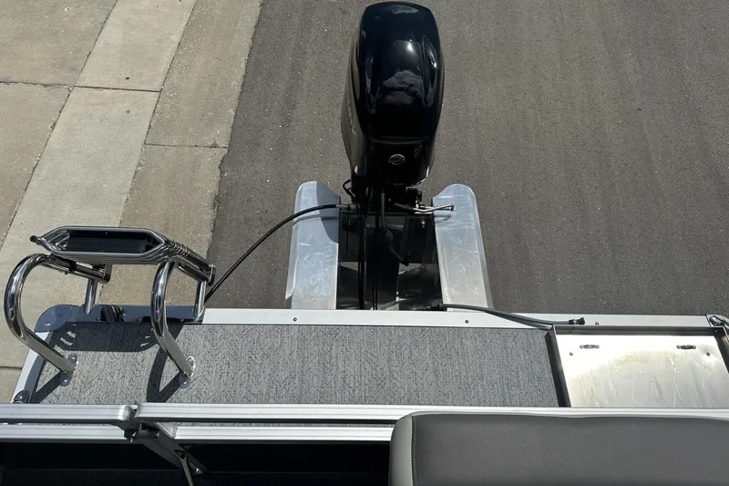 Slide: The Image of 2026 Sun Tracker Bass Buggy 16 XL Select pontoon boat with outboard motor, top view. - 16