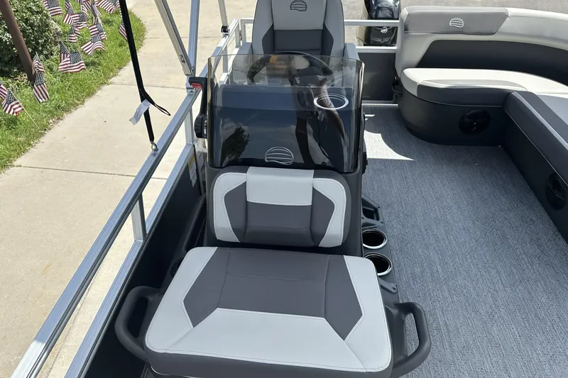 Slide: The Image of 2026 Sun Tracker Bass Buggy 16 XL Select interior with modern seating and console design. - 10