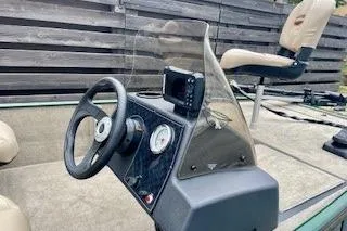 Slide: The Image of 2026 Tracker Bass Tracker Classic Limited boat interior with steering wheel and dashboard. - 3