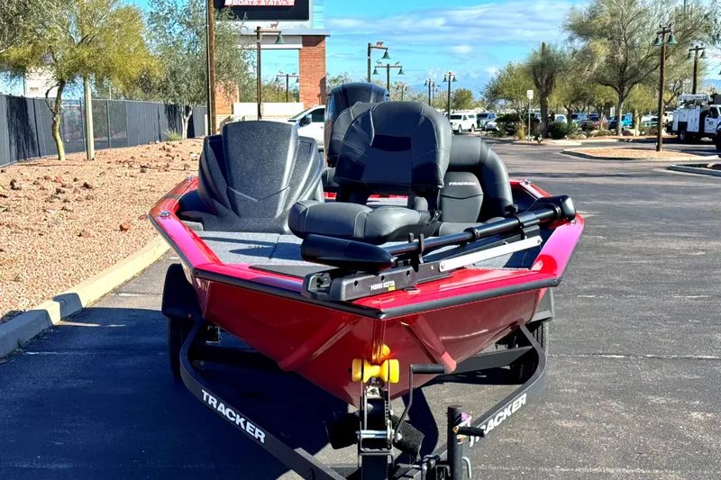 Slide: The Image of 2026 Tracker Pro Team 175 boat in parking lot, featuring sleek red design and comfortable seating. - 2