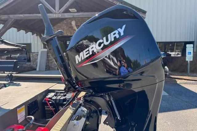 Slide: The Image of 2024 Tracker Grizzly 1754 MVX Jon boat with Mercury outboard motor. - 7