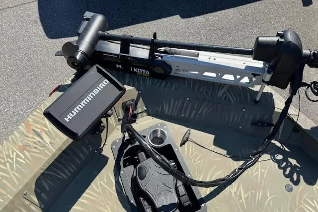 Slide: The Image of 2024 Tracker Grizzly 1754 MVX Jon boat with Humminbird and Minn Kota accessories. - 8