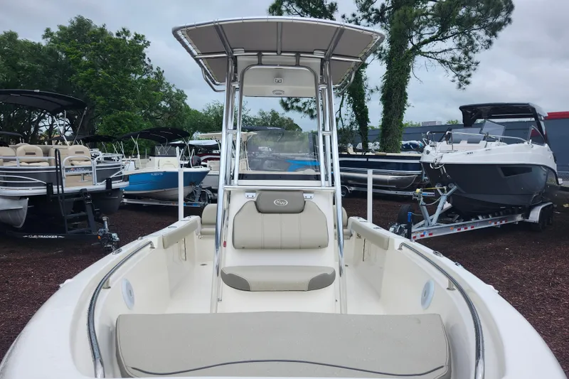 Slide: The Image of 2024 Key West 189 FS boat displayed outdoors among other boats. - 10