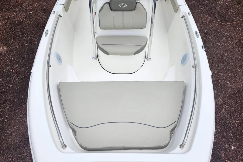 Slide: The Image of 2024 Key West 189 FS boat interior with cushioned seating and sleek design. - 11
