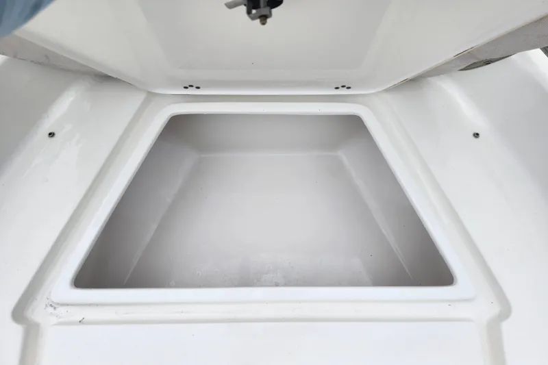 Slide: The Image of Storage compartment of 2024 Key West 189 FS boat, open and empty. - 14