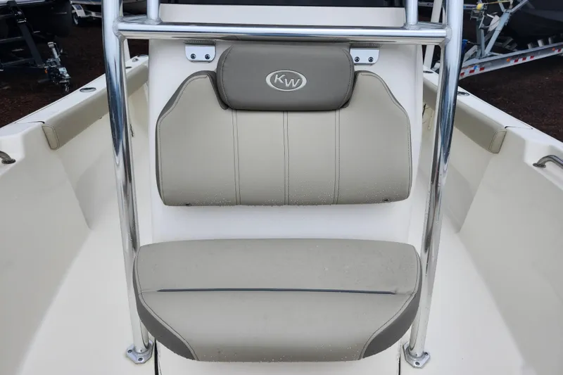 Slide: The Image of 2024 Key West 189 FS boat seat with beige upholstery and chrome frame. - 15