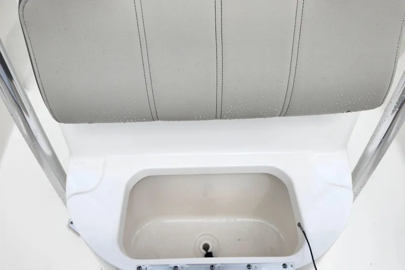 Slide: The Image of 2024 Key West 189 FS boat seat and storage compartment detail. - 16