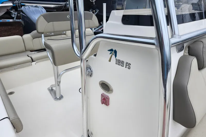 Slide: The Image of 2024 Key West 189 FS boat interior with seating and console details. - 18
