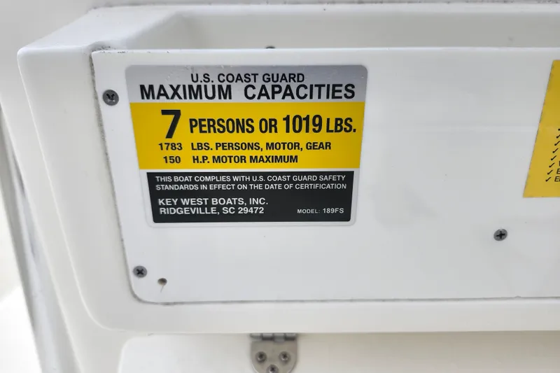 Slide: The Image of 2024 Key West 189 FS boat capacity label, 7 persons or 1019 lbs, 150 HP motor. - 20