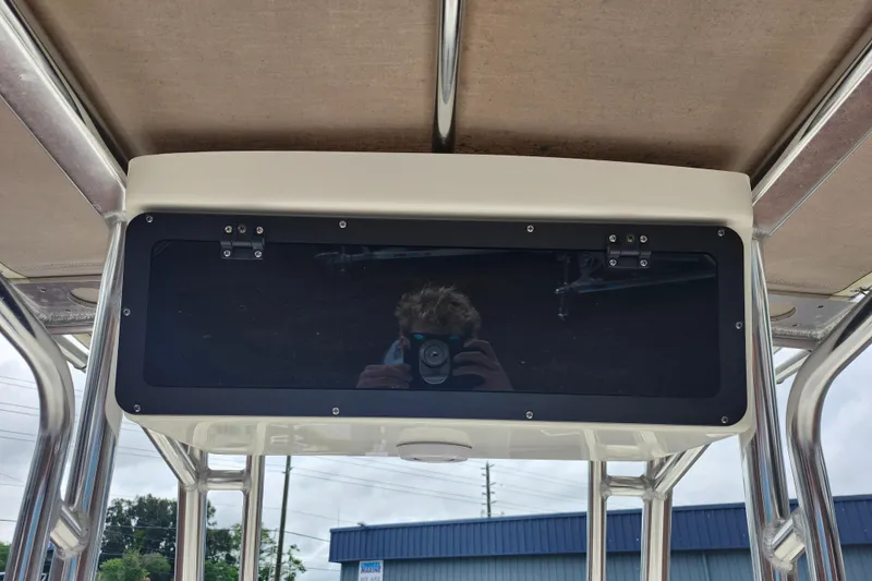 Slide: The Image of 2024 Key West 189 FS boat console with reflection, under canopy. - 21
