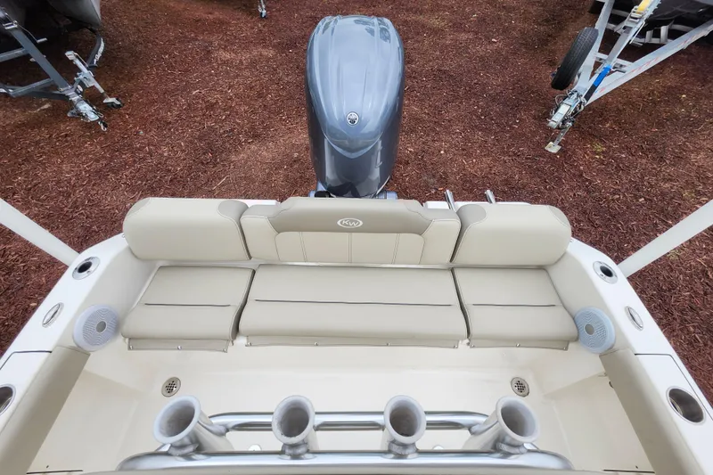 Slide: The Image of 2024 Key West 189 FS boat with beige seating and outboard motor. - 24