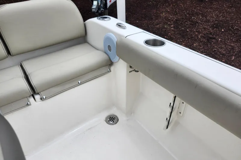 Slide: The Image of Interior of 2024 Key West 189 FS boat with beige seating and cup holder. - 25