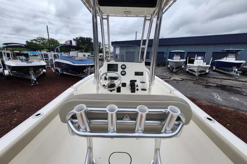 Slide: The Image of 2024 Key West 189 FS boat interior with steering console and rod holders. - 28