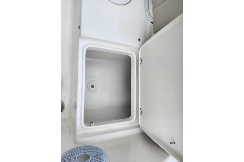 Slide: The Image of 2024 Key West 189 FS boat storage compartment with open hatch. - 33