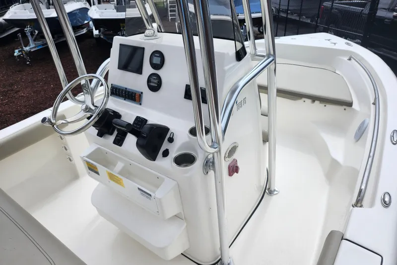 Slide: The Image of 2024 Key West 189 FS boat console with steering wheel and controls. - 36
