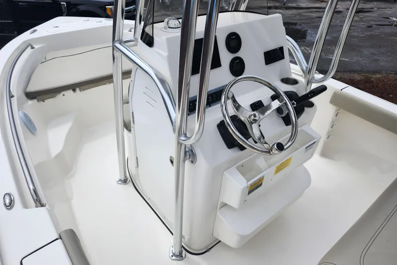 Slide: The Image of 2024 Key West 189 FS boat interior with steering console and seating area. - 37