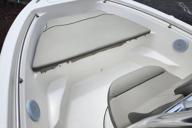 Slide: The Image of 2024 Key West 189 FS boat interior with cushioned seating and speakers. - 38