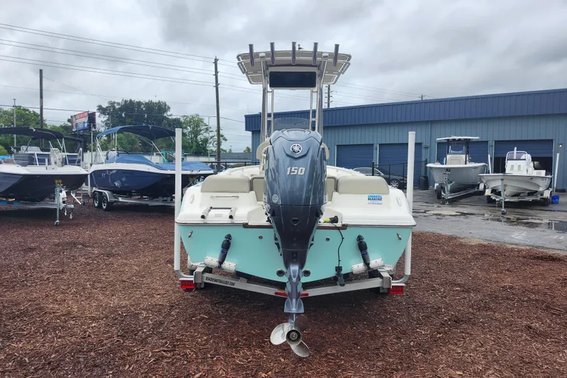 Slide: The Image of 2024 Key West 189 FS boat with Yamaha 150 engine at a dealership. - 7